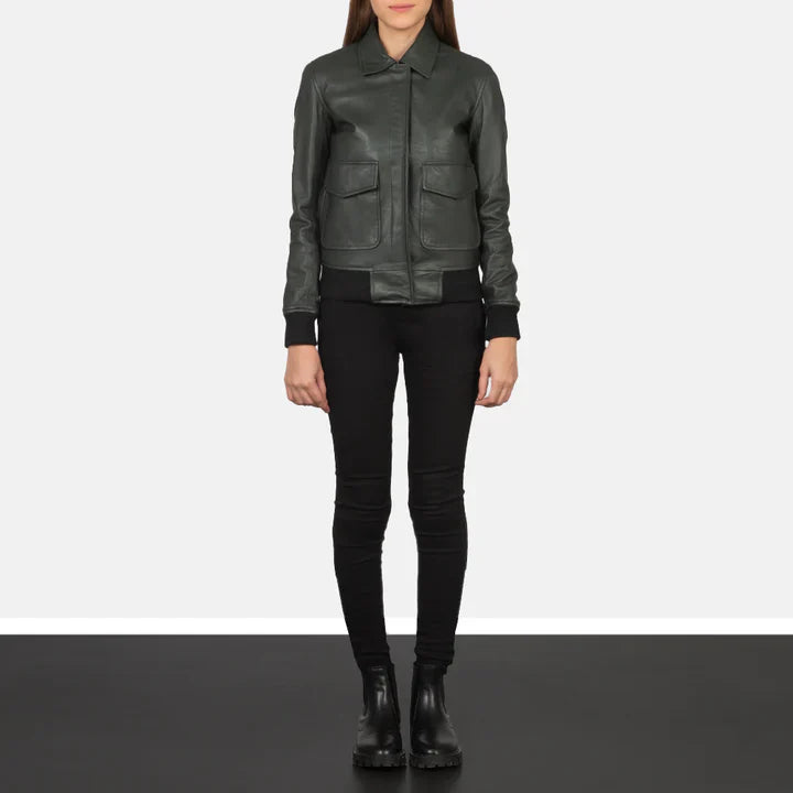 Person wearing a dark green leather jacket and black pants on a white background
